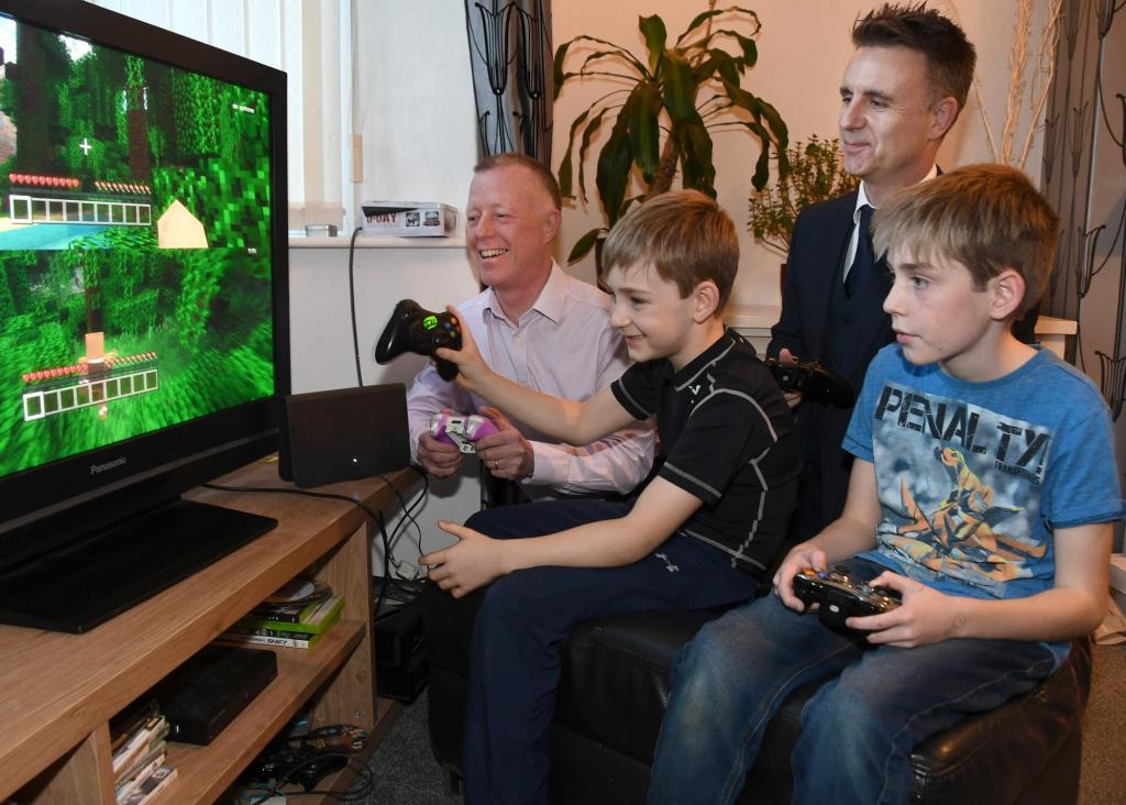 Paul Crane, TalkTalk, plays with James aged 7, Ryan, aged 11, and their father Richard Grayling at their home in Dringhouses (2)